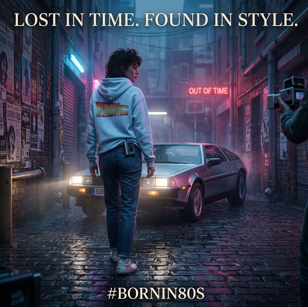 Person wearing a light blue Born in the 80s hoodie beside a silver sports car in a neon-lit alley, under the headline Lost in time. Found in style.