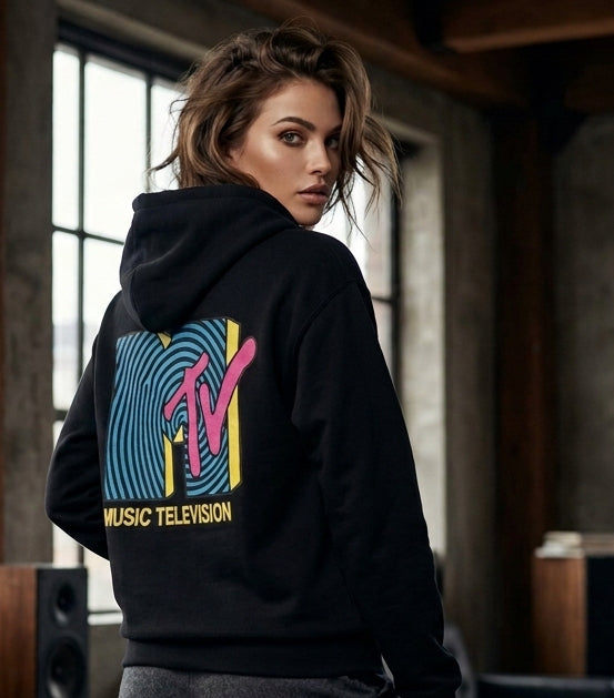 Model wearing a black hoodie with a colorful retro MTV graphic on the back.
