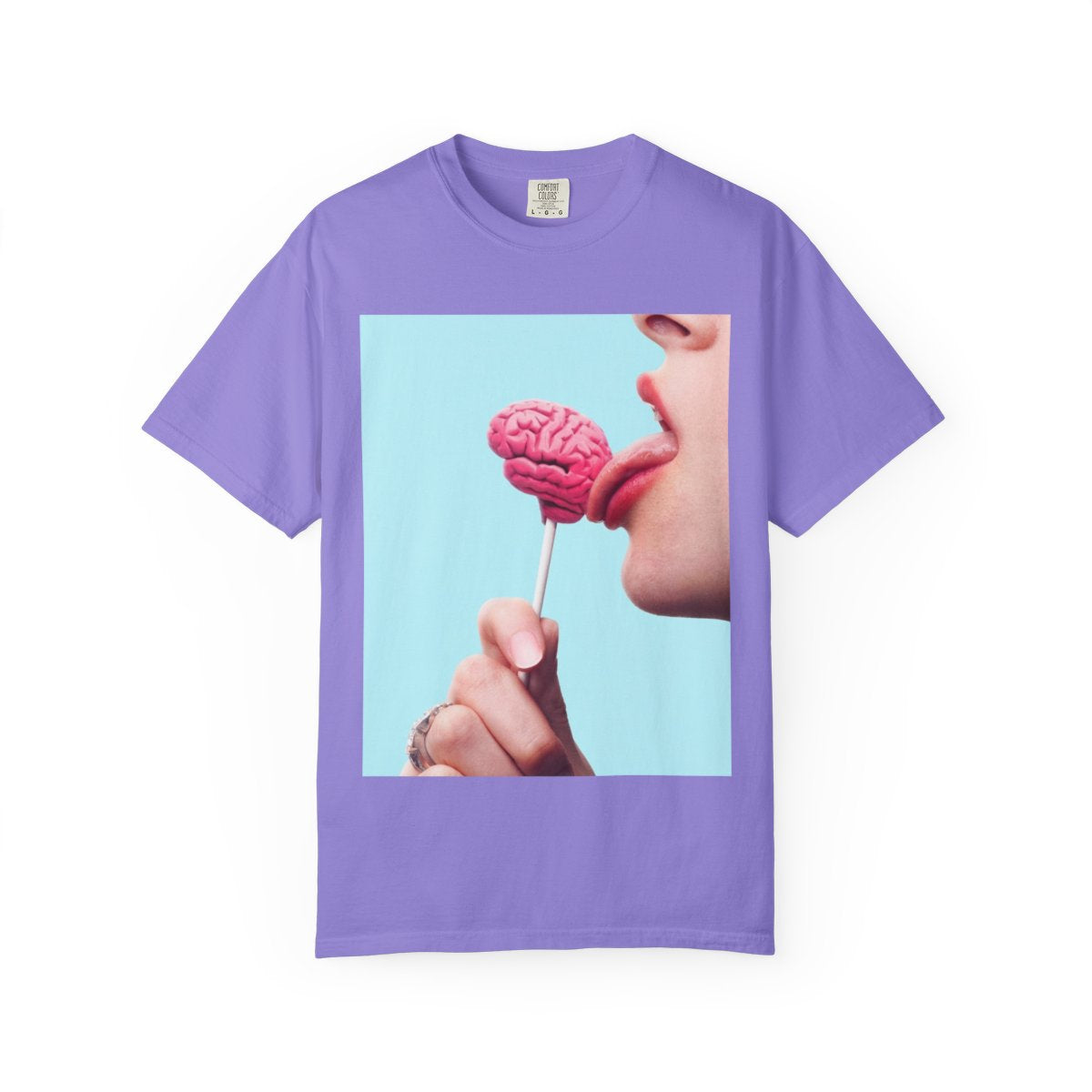 Lickin Brain T-Shirt in Violet with a surreal print of a tongue licking a pink brain lollipop against a turquoise background.
